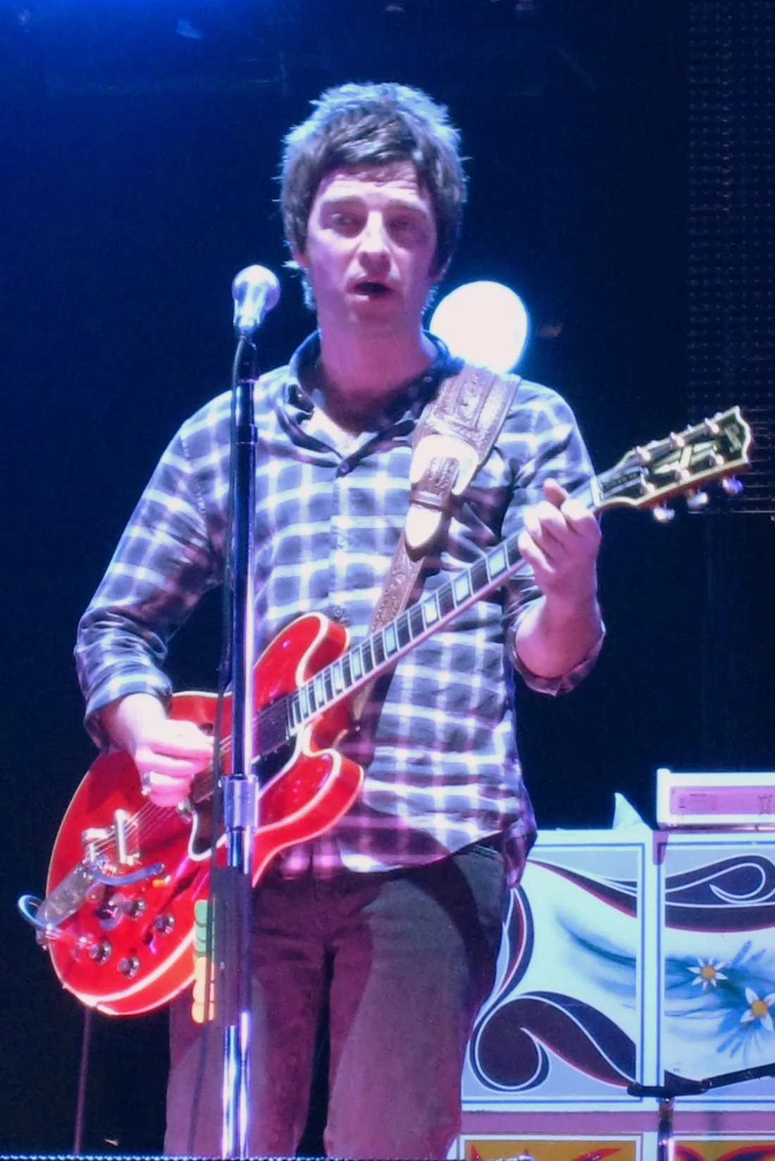 Rock guitarist playing an electric guitar during a live show