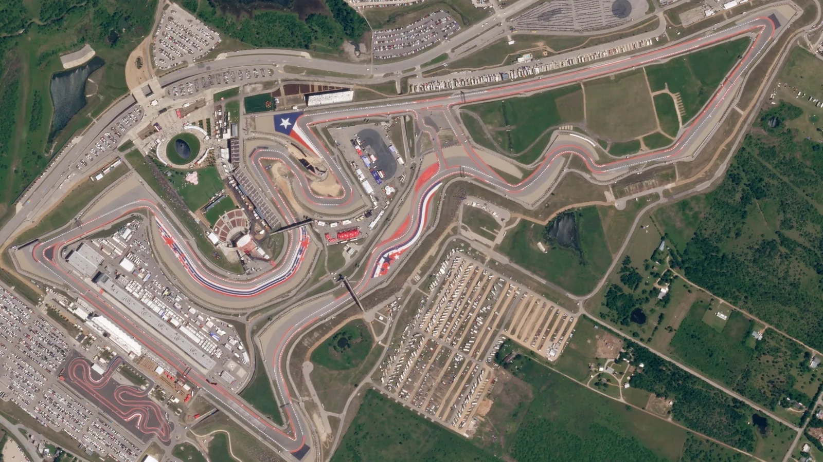 Cars on a motor-racing circuit