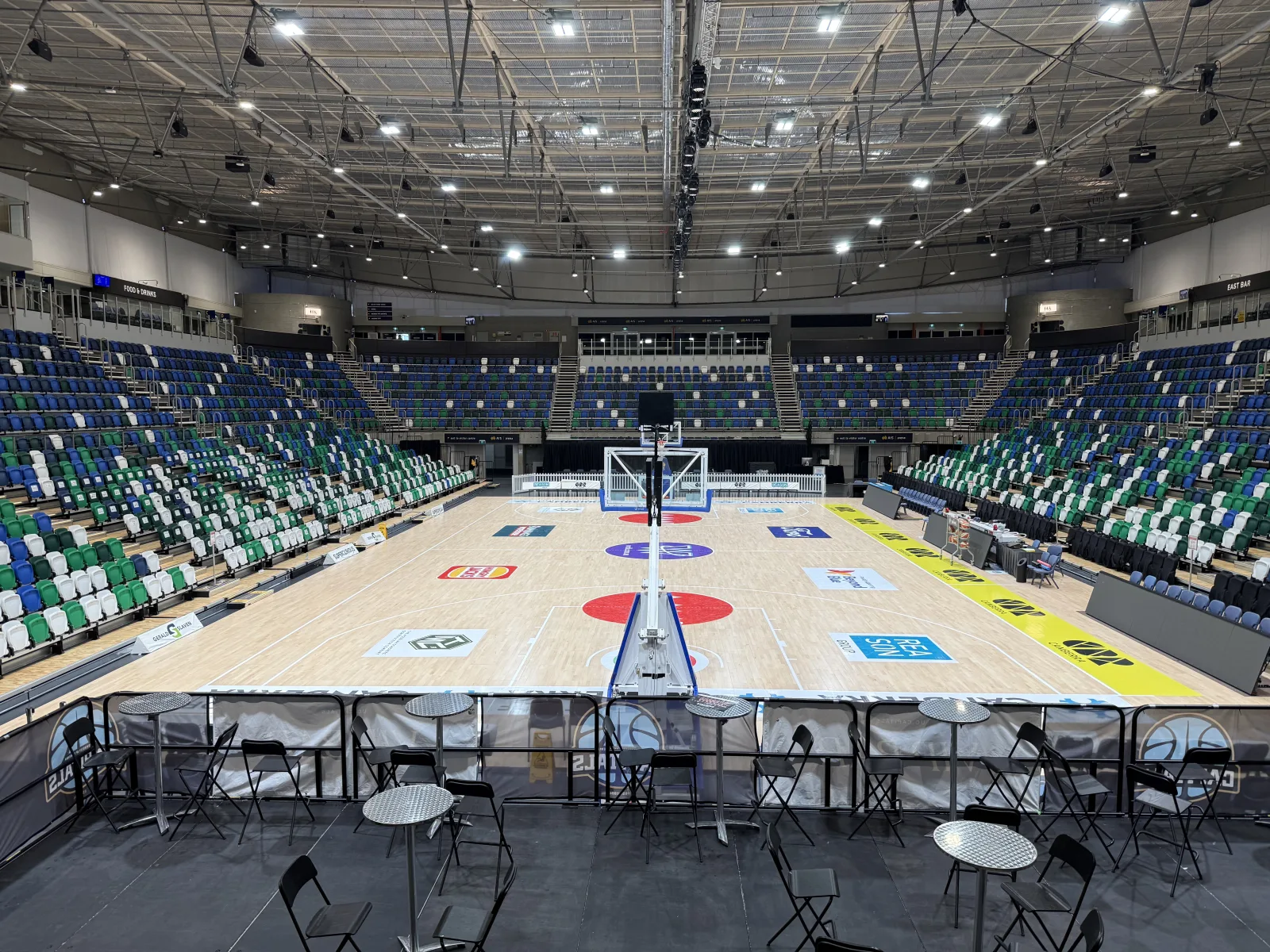 The court inside an indoor basketball arena