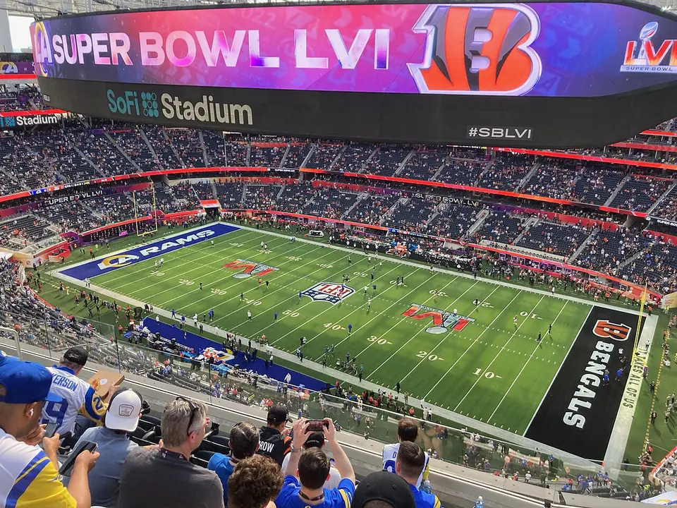 SoFi Stadium interior during a Super Bowl with the halo videoboard lit