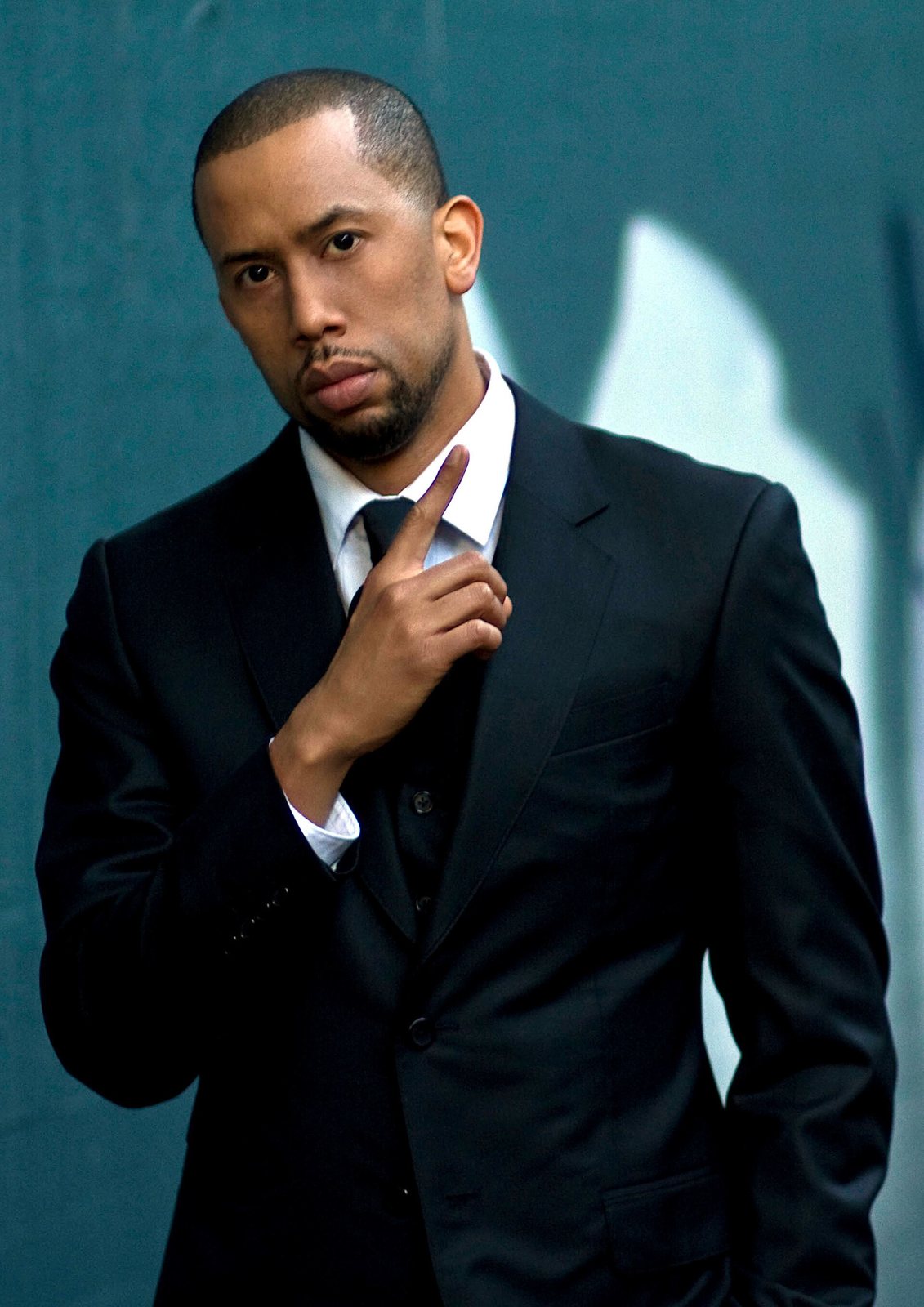 Comedian Affion Crockett in a dark suit, 2010