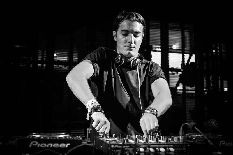 Alesso playing a DJ set at Ushuaia, Ibiza, in black and white