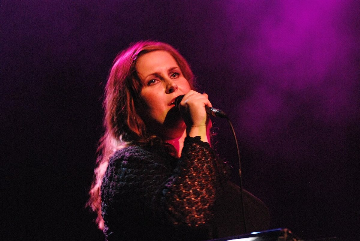 Buy Alison Moyet tickets on StubOrder Alison Moyet singing into a microphone on stage in Dublin, 2008