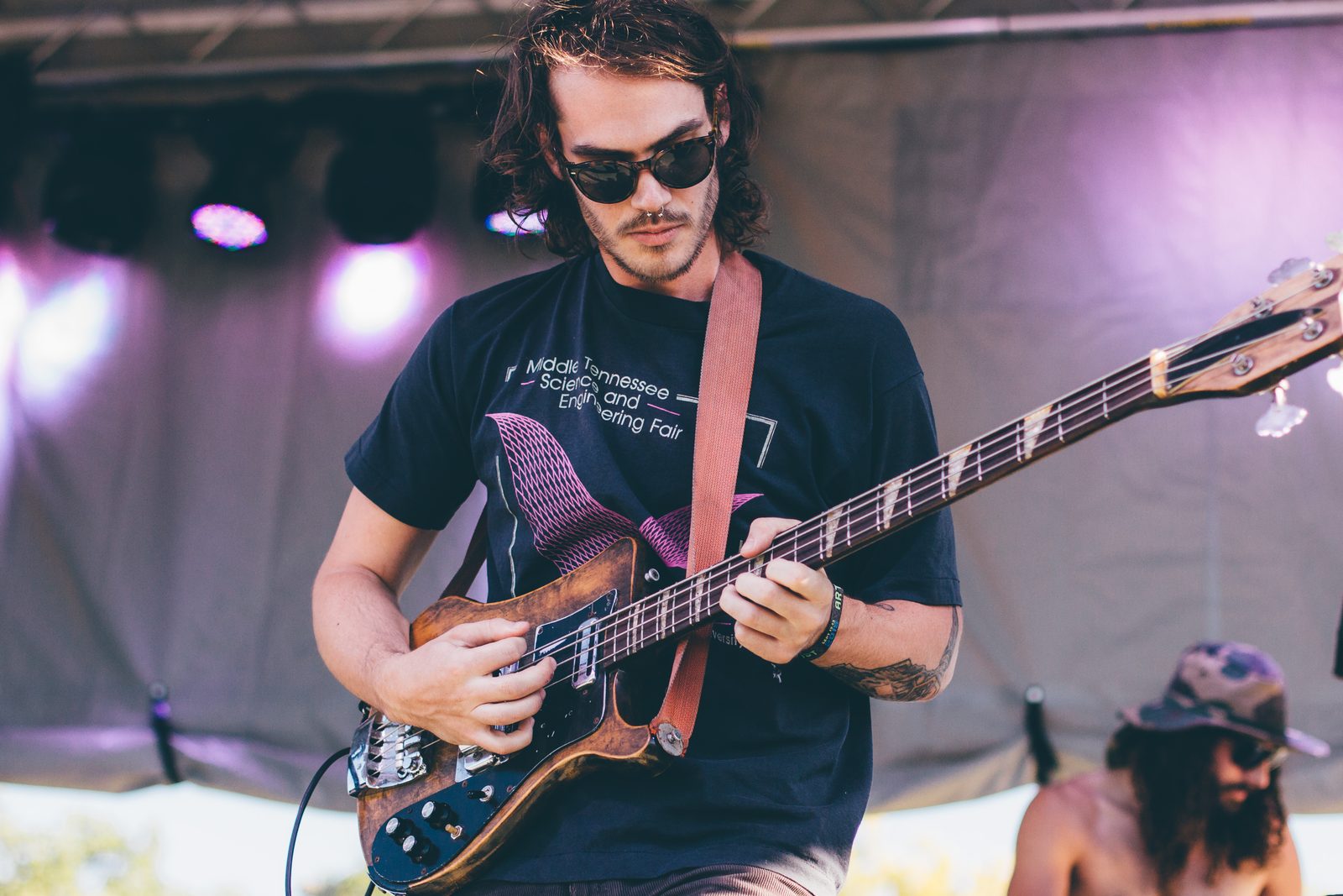 All Them Witches bassist playing on stage at an outdoor show, 2014 - All Them Witches tickets