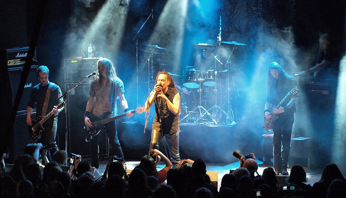 Amorphis performing live on a smoky blue-lit stage, 2008