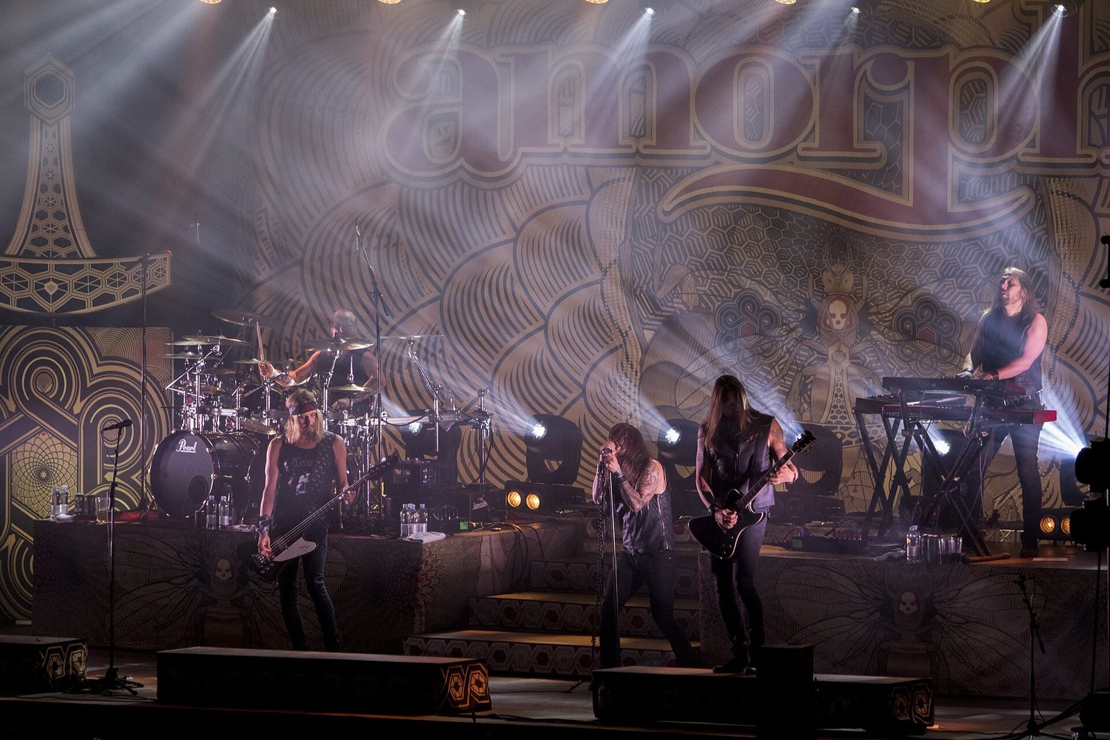 Amorphis performing in front of their logo backdrop at the John Smith Festival, Peurunka, Finland, 2019