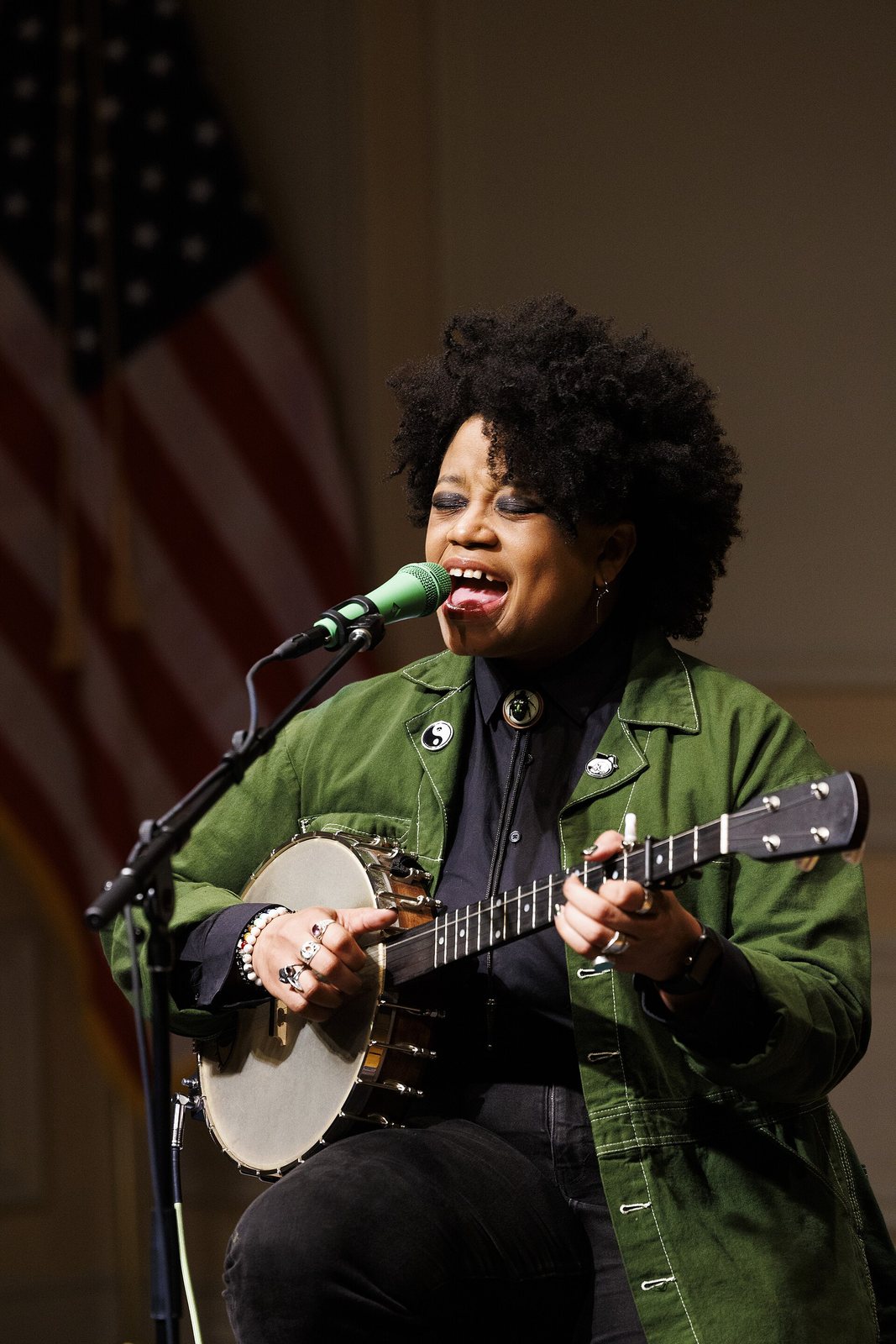 Amythyst Kiah singing with a banjo at the Library of Congress Coolidge Auditorium, Washington, 2026