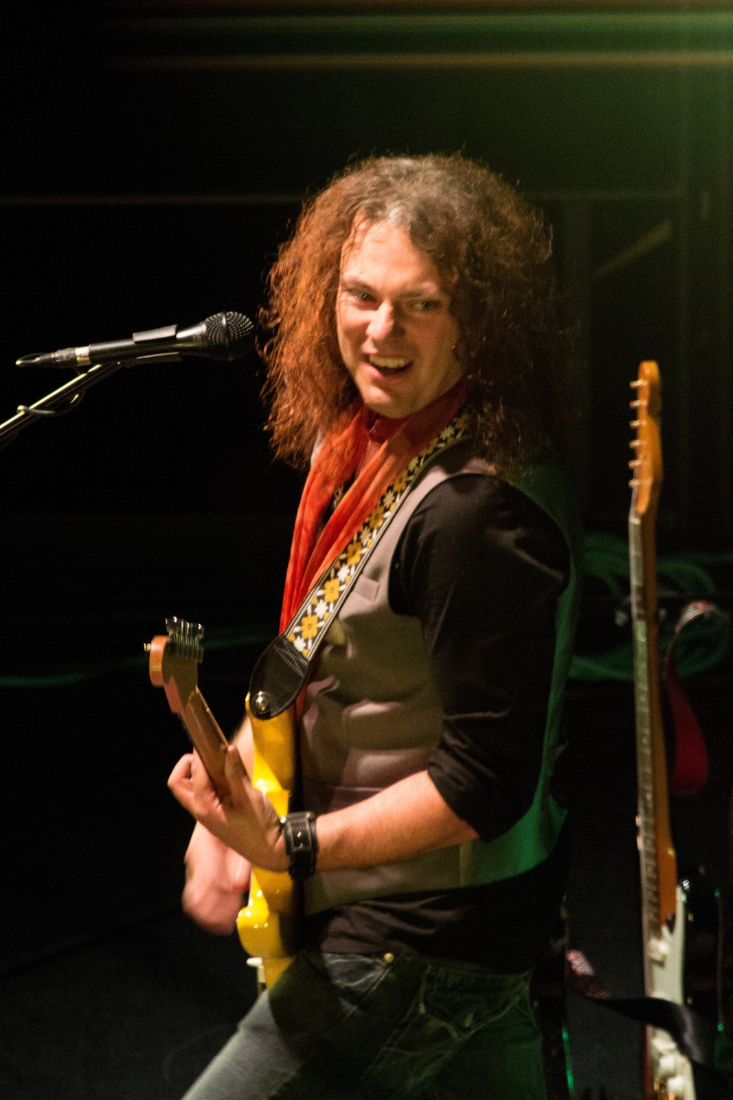 Anthony Gomes playing guitar at the Mississippi Valley Blues Fest, Davenport, Iowa, 2013