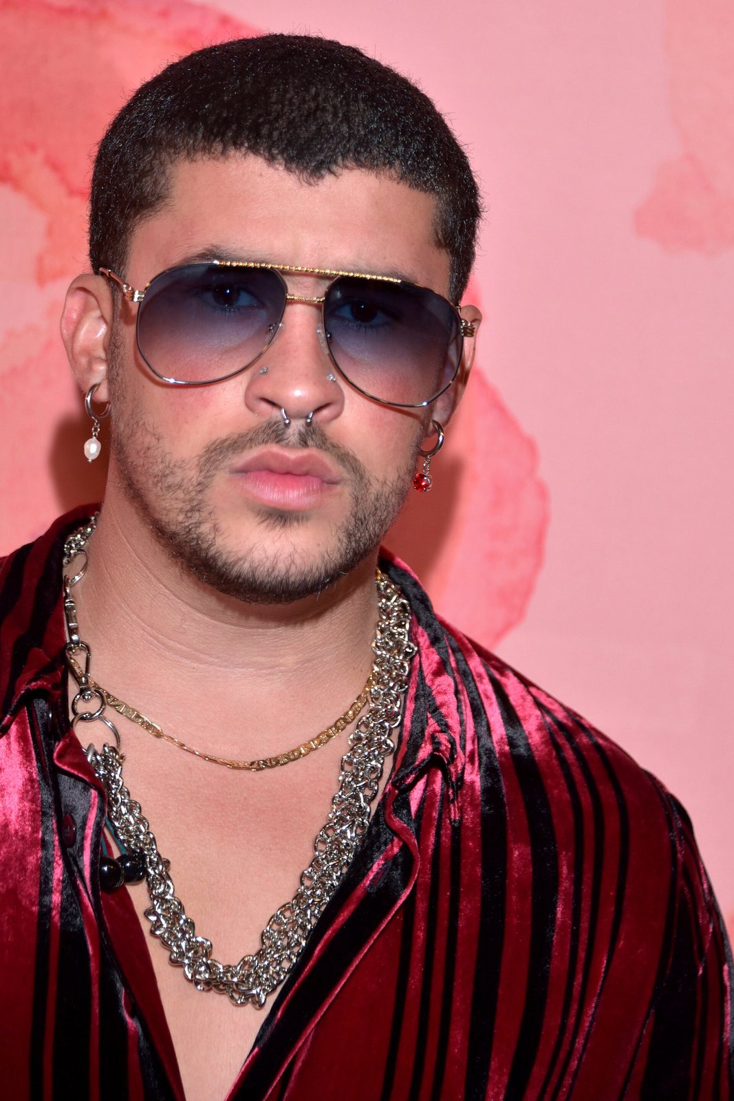 Bad Bunny in aviator sunglasses and a striped velvet shirt, Los Angeles, October 2019