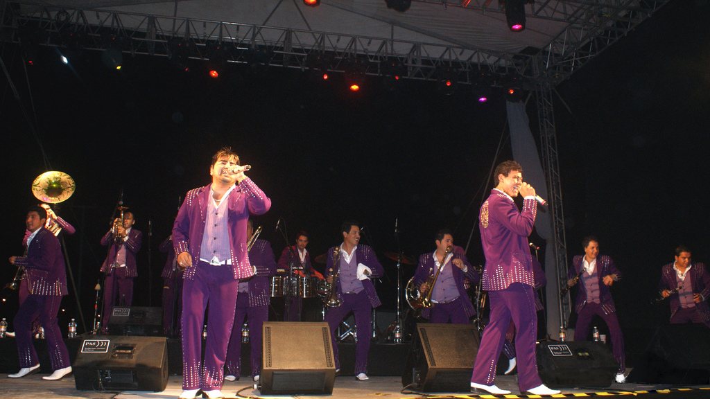 Banda El Recodo performing in matching purple suits in Cancún, Mexico, July 2009