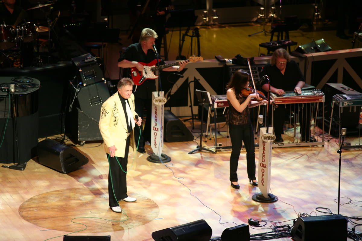 Buy Bill Anderson tickets on StubOrder Bill Anderson singing onstage with his band at the Grand Ole Opry