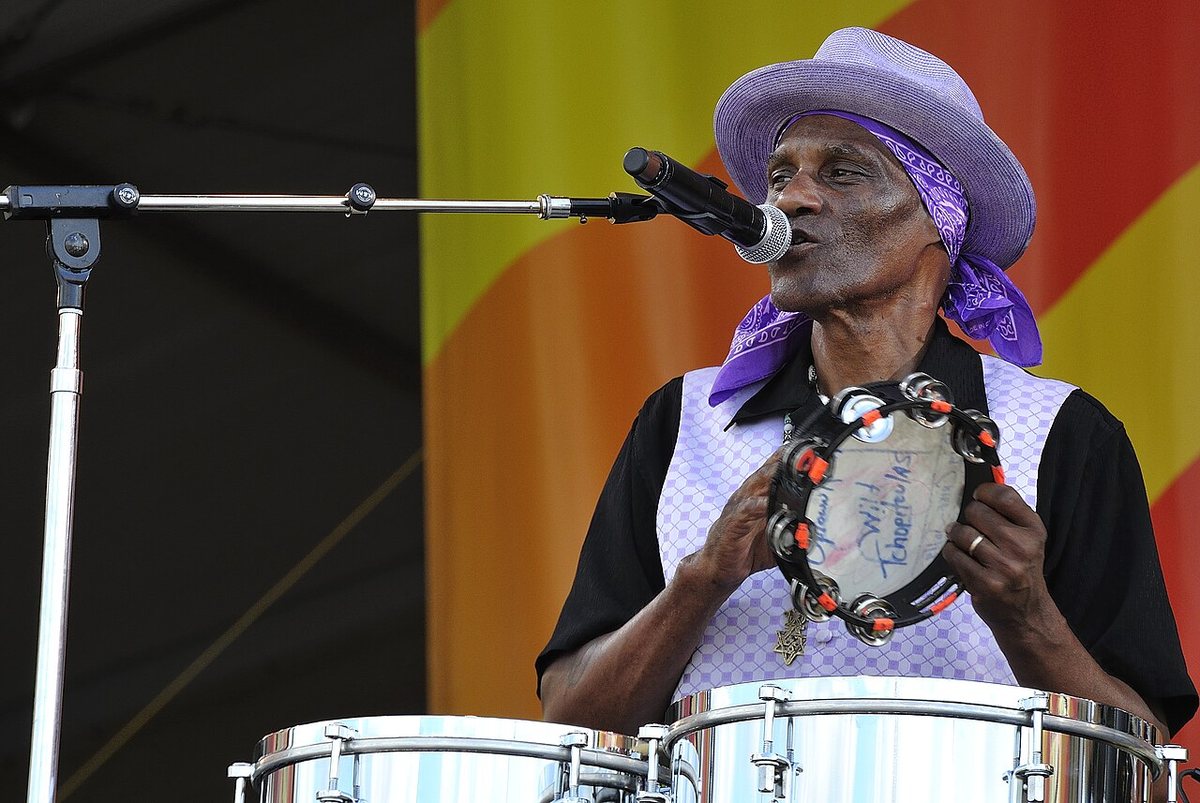 Buy Cyril Neville tickets on StubOrder Cyril Neville singing with a tambourine at the New Orleans Jazz and Heritage Festival, 2012