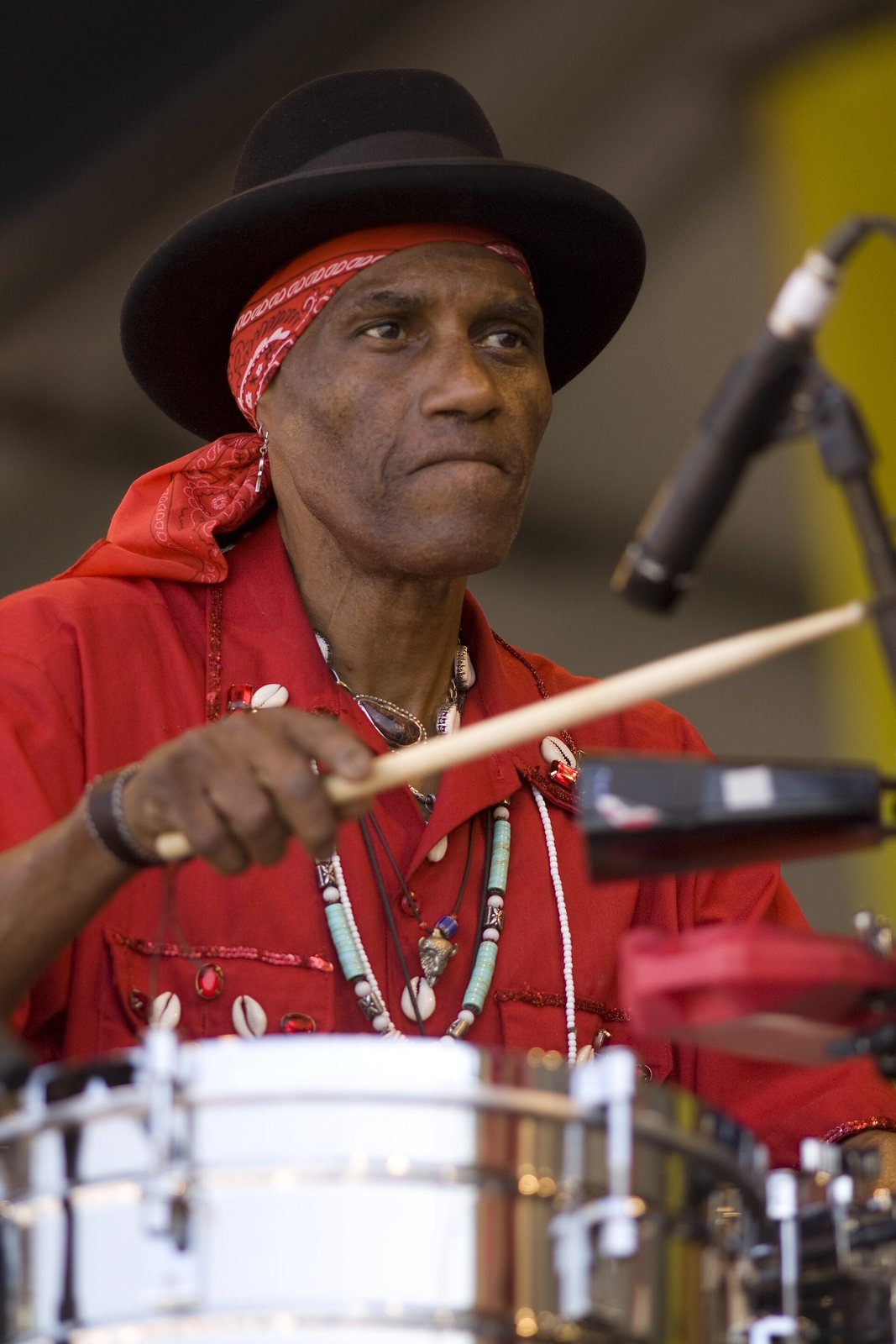Cyril Neville playing percussion with the Voice of the Wetlands All Stars at New Orleans Jazz Fest, 2010