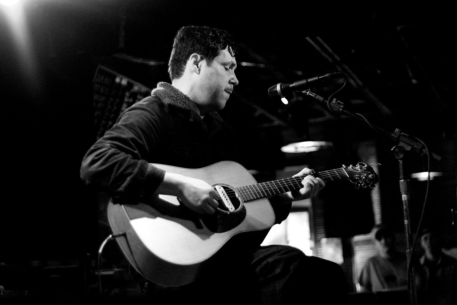 Damien Jurado performing on acoustic guitar at Dan's Silverleaf, Denton, Texas, 2009