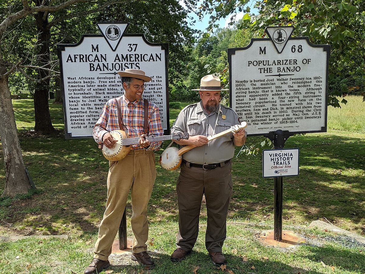 Buy Dom Flemons tickets on StubOrder Dom Flemons playing banjo with a park ranger at Appomattox Court House National Historical Park, 2019