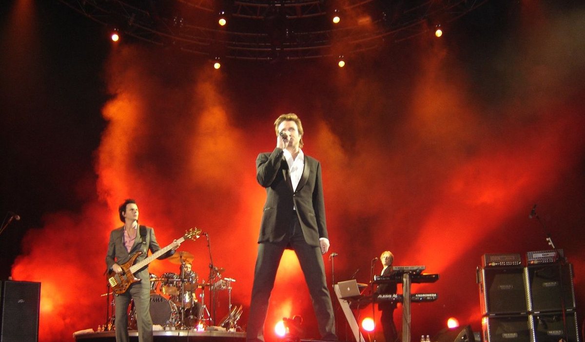 Buy Duran Duran tickets on StubOrder Simon Le Bon, John Taylor and Nick Rhodes of Duran Duran on stage in Toronto, April 2005