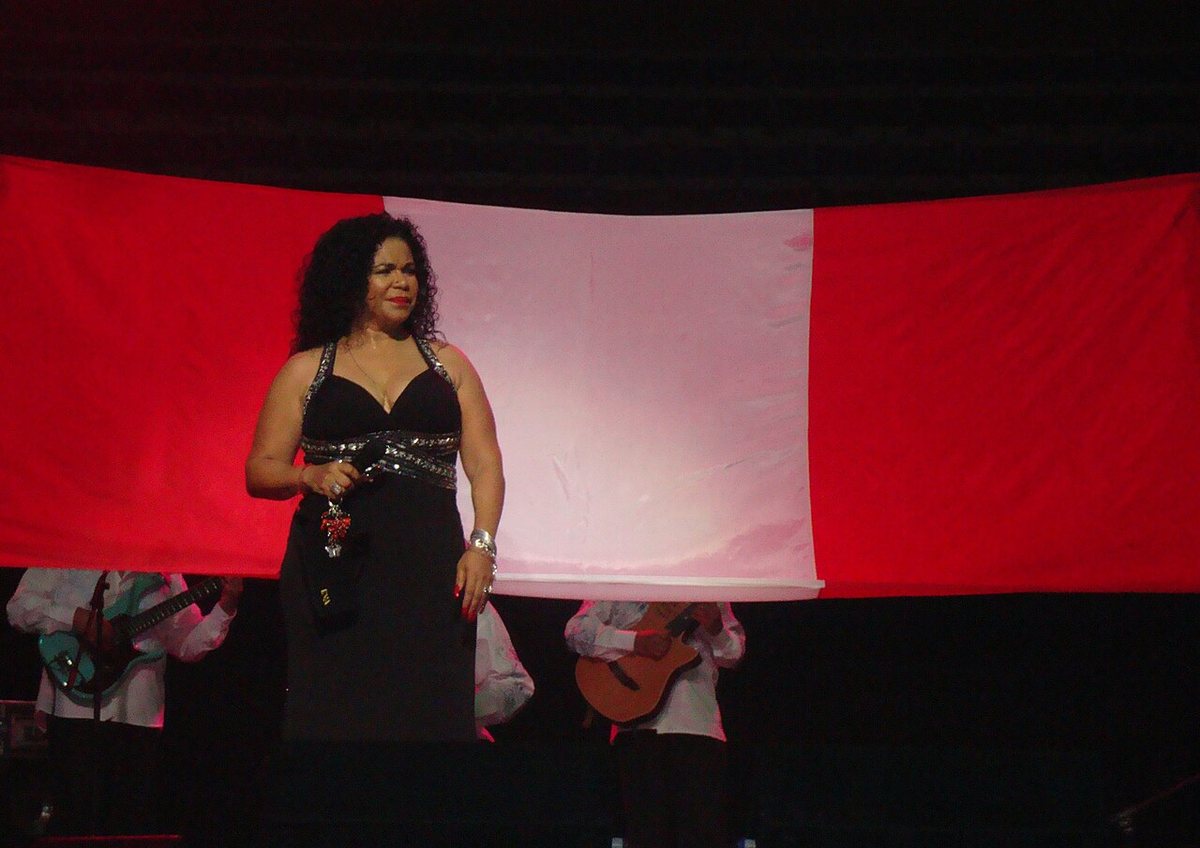 Buy Eva Ayllon tickets on StubOrder Eva Ayllón performing in front of a Peruvian flag at the Sydney Opera House, 2010
