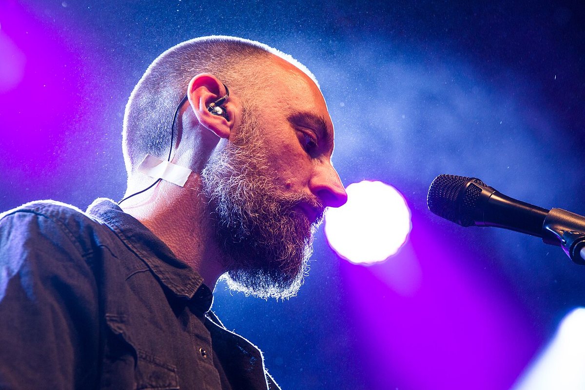 Buy Fink tickets on StubOrder Fink in profile at the microphone on stage at the Rudolstadt Festival, Germany, 2014
