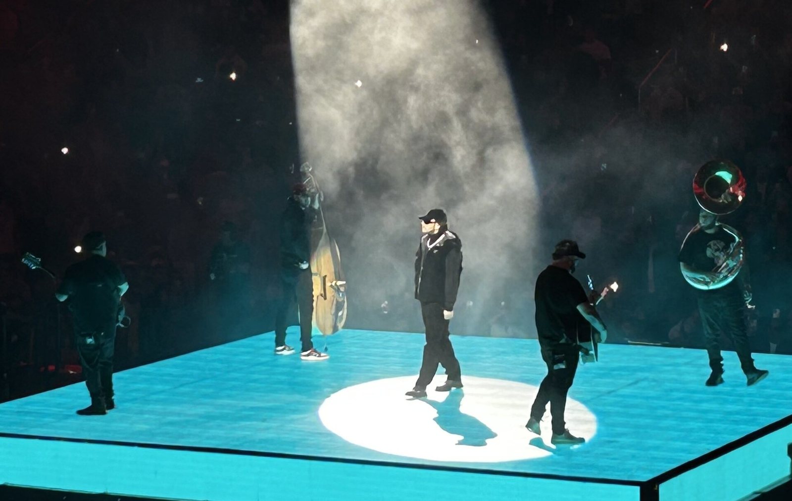 Fuerza Regida performing on a lit stage at Capital One Arena, Washington, D.C., October 2024