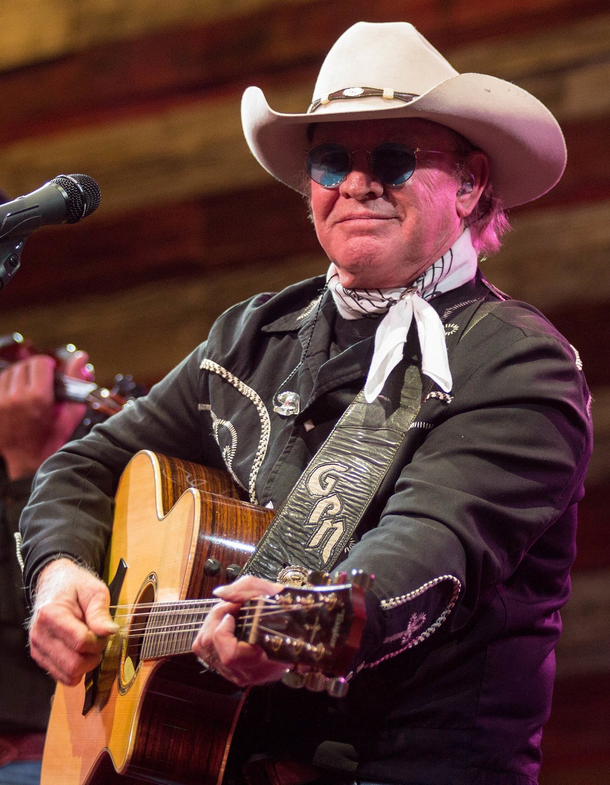 Gary P. Nunn playing acoustic guitar on stage at the Redneck Country Club, Texas, 2016