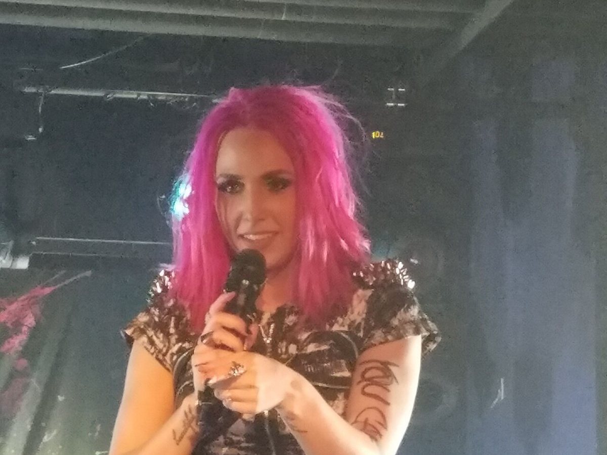 Ariel Bloomer of Icon for Hire singing on stage, 2016