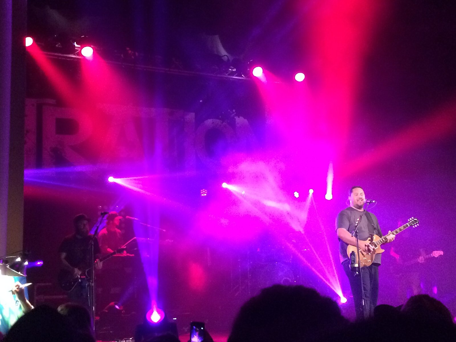 Iration performing live in Eugene, Oregon, February 2016, with the band's name on the backdrop