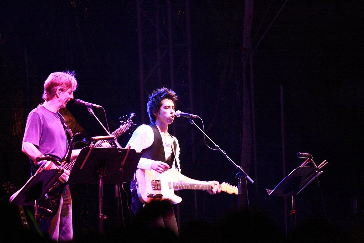 Buy Anders Osborne & Jackie Greene tickets on StubOrder Jackie Greene singing and playing guitar beside Phil Lesh on a festival stage, 2008