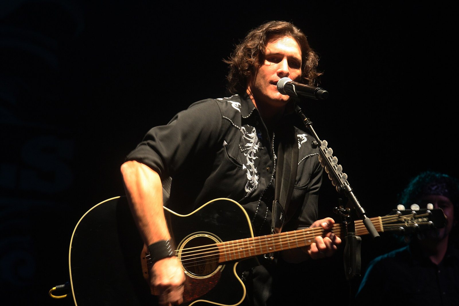 Joe Nichols singing with an acoustic guitar at the North Carolina Country Music Freedom Festival, Maysville, 2011