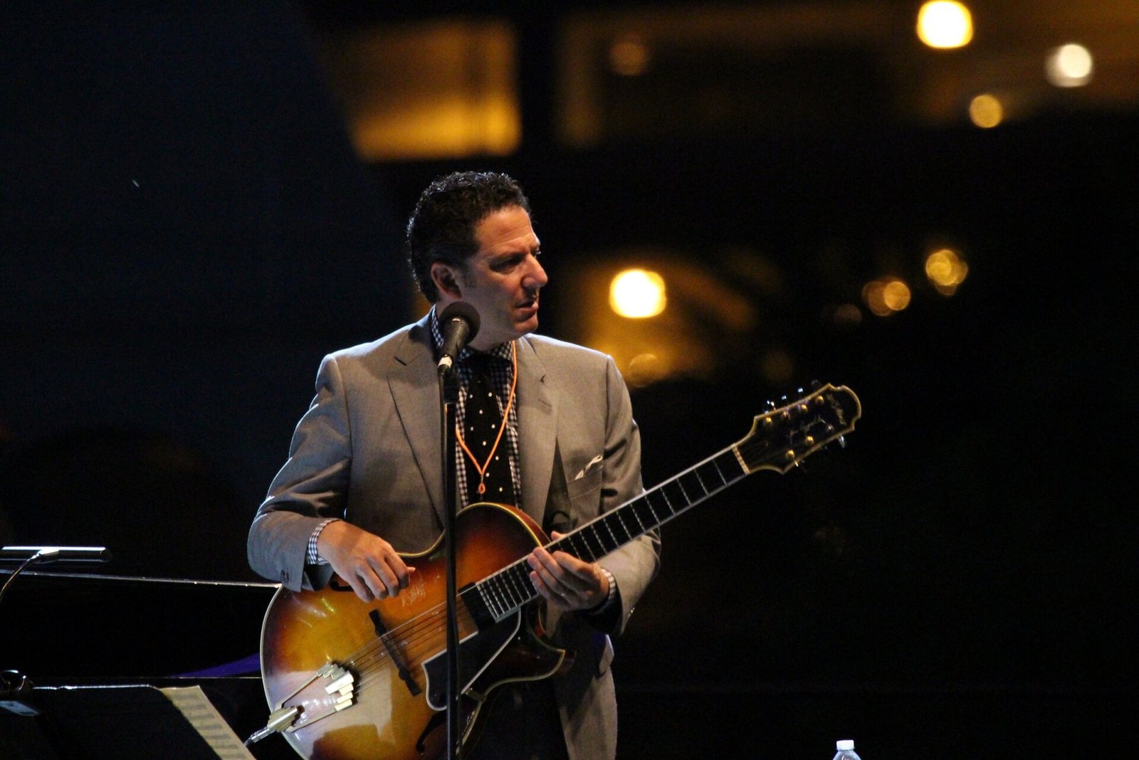 John Pizzarelli playing guitar on stage, 2014