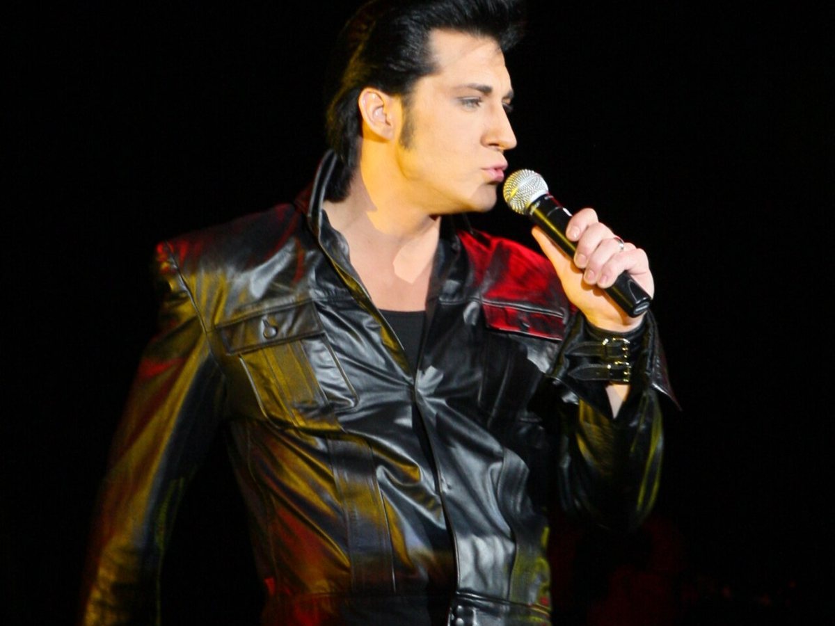 An Elvis tribute artist singing on stage at Legends in Concert, Myrtle Beach, December 2008
