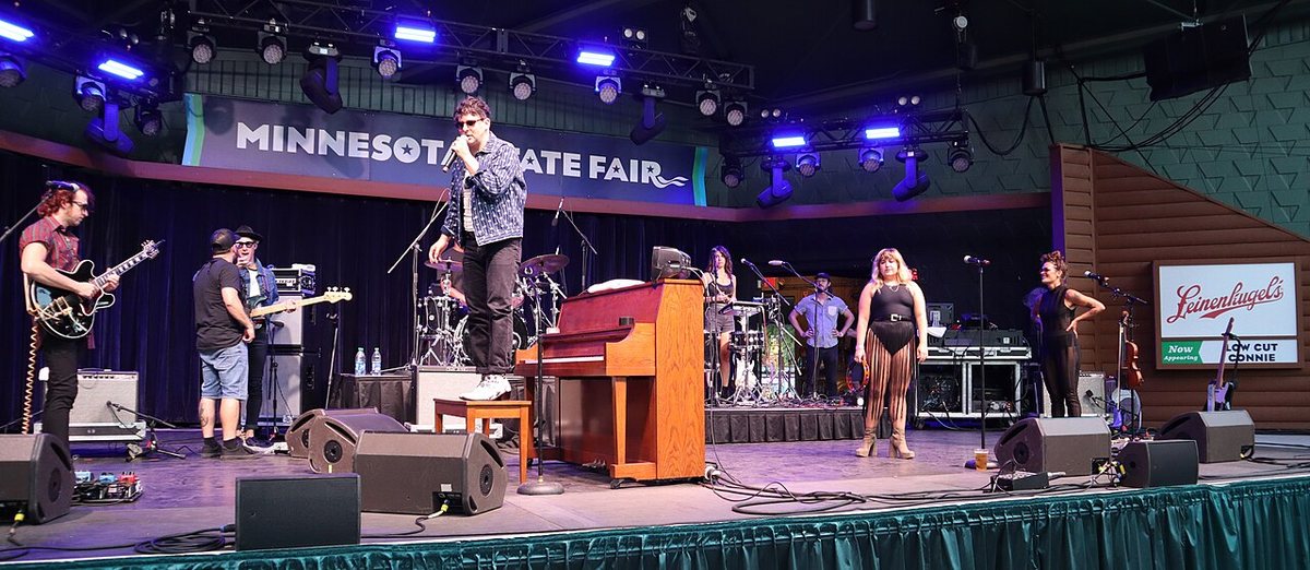 Adam Weiner of Low Cut Connie standing on his piano bench during a sound check at the 2022 Minnesota State Fair