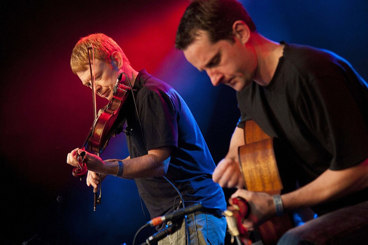 Buy Lunasa tickets on StubOrder Lunasa fiddler and guitarist performing at the Cambridge Folk Festival, 2010