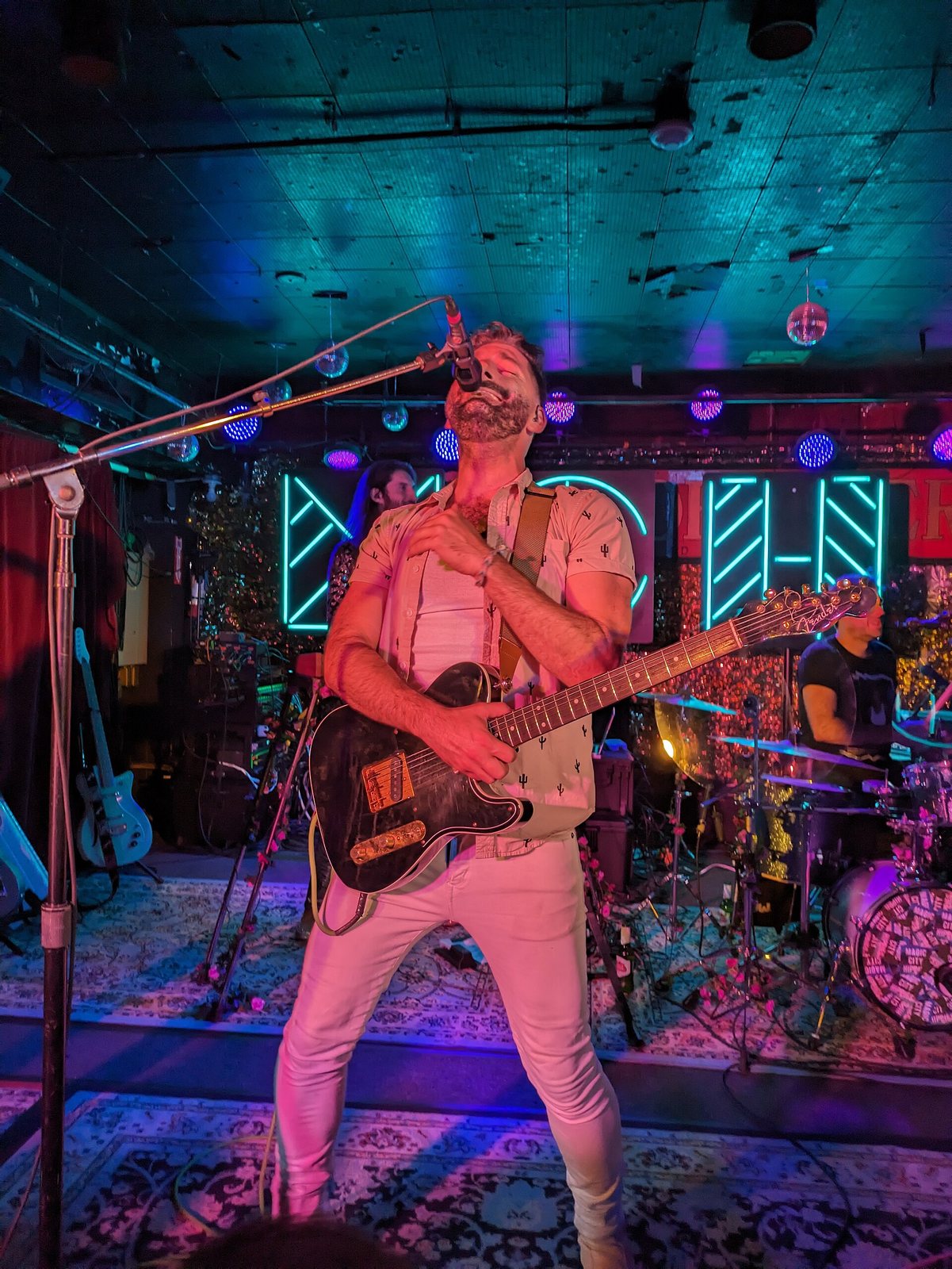 Magic City Hippies frontman singing and playing guitar at the Horseshoe Tavern, Toronto, 2023