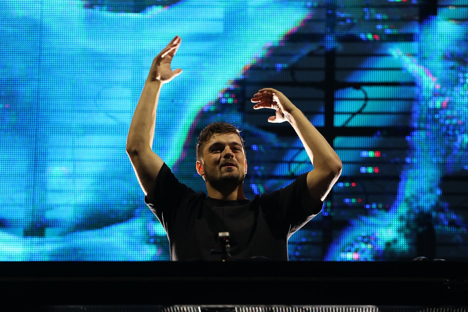 Martin Garrix performing with arms raised at Southside Festival, Germany, 2022