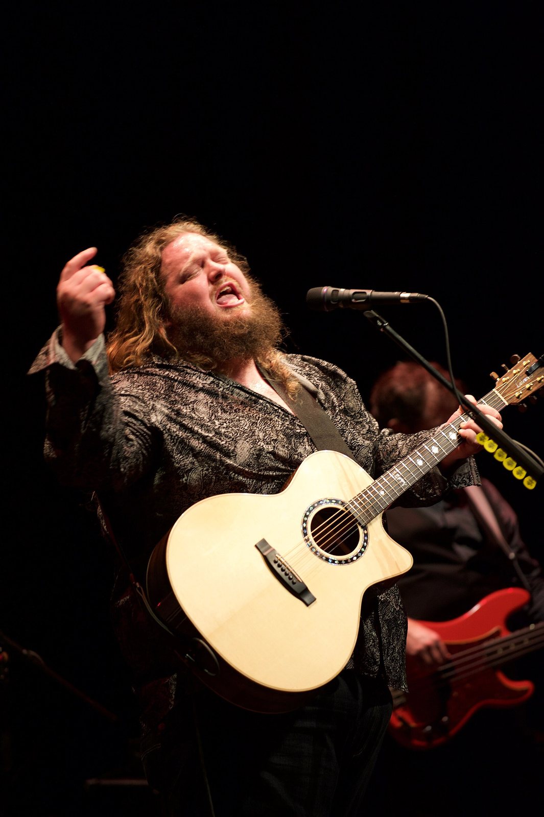 Matt Andersen singing with an acoustic guitar at the National Arts Centre, Ottawa, 2016