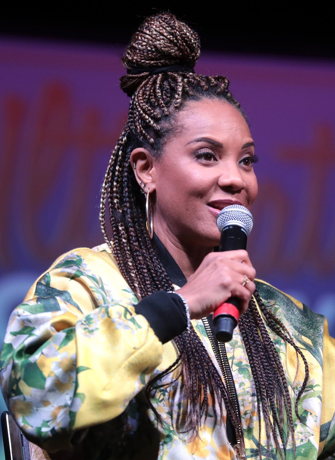 MC Lyte speaking into a microphone at an event in Phoenix, Arizona, 2019