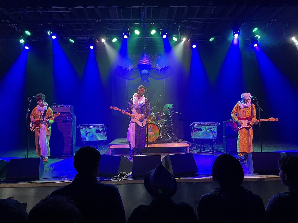 Mdou Moctar and band performing on stage in Knoxville, Tennessee, 2022