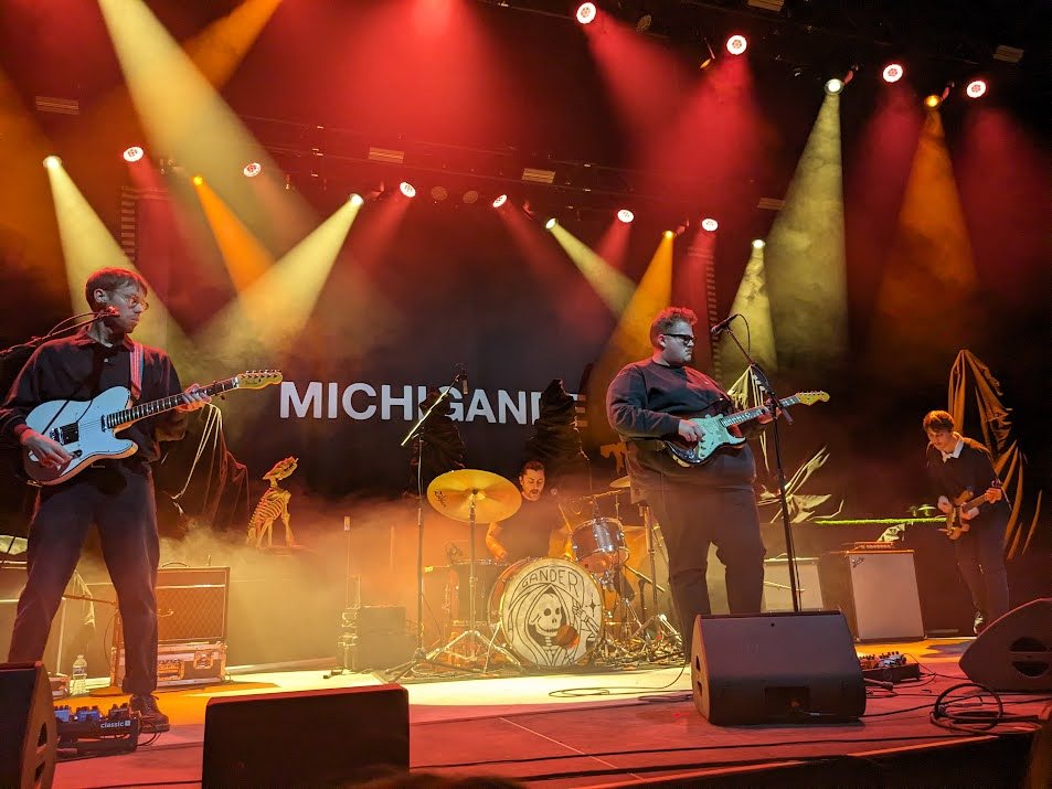 Michigander performing in front of their name backdrop at the Uptown Theater, Minneapolis, December 2023
