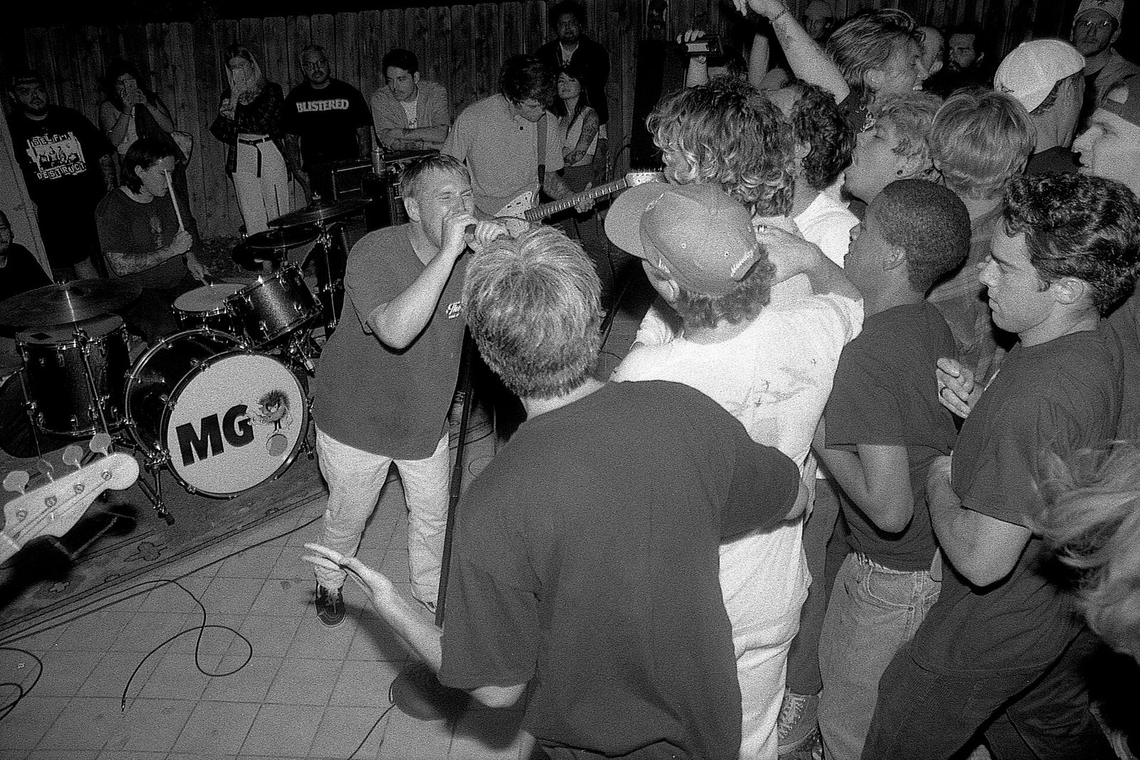 Militarie Gun singer performing in a packed room at the band's first live show, Oceanside, California, 2021