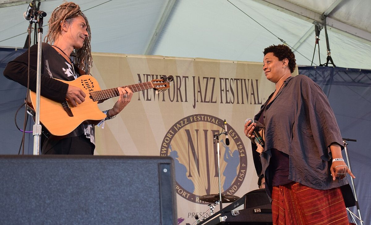 Lisa Fischer performing with Grand Baton in front of the Newport Jazz Festival banner, 2015