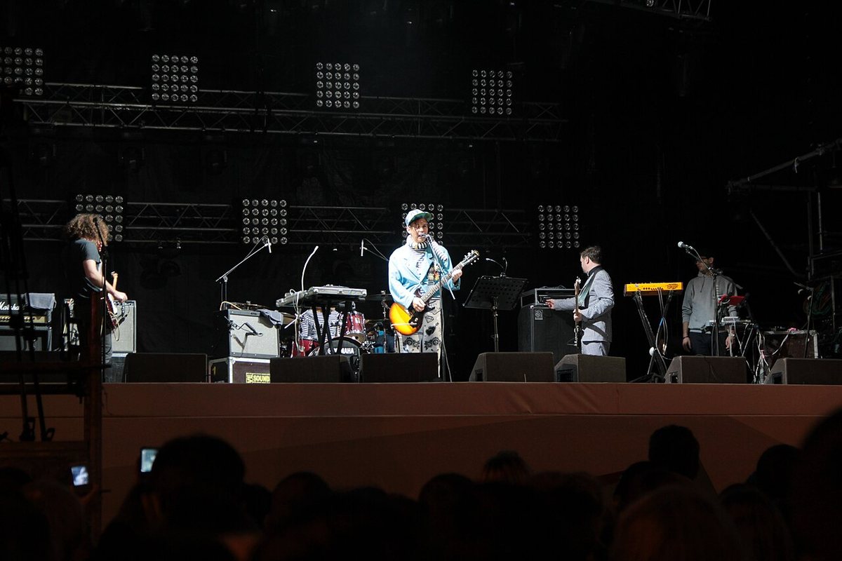 Mumiy Troll performing on a lit concert stage in 2013