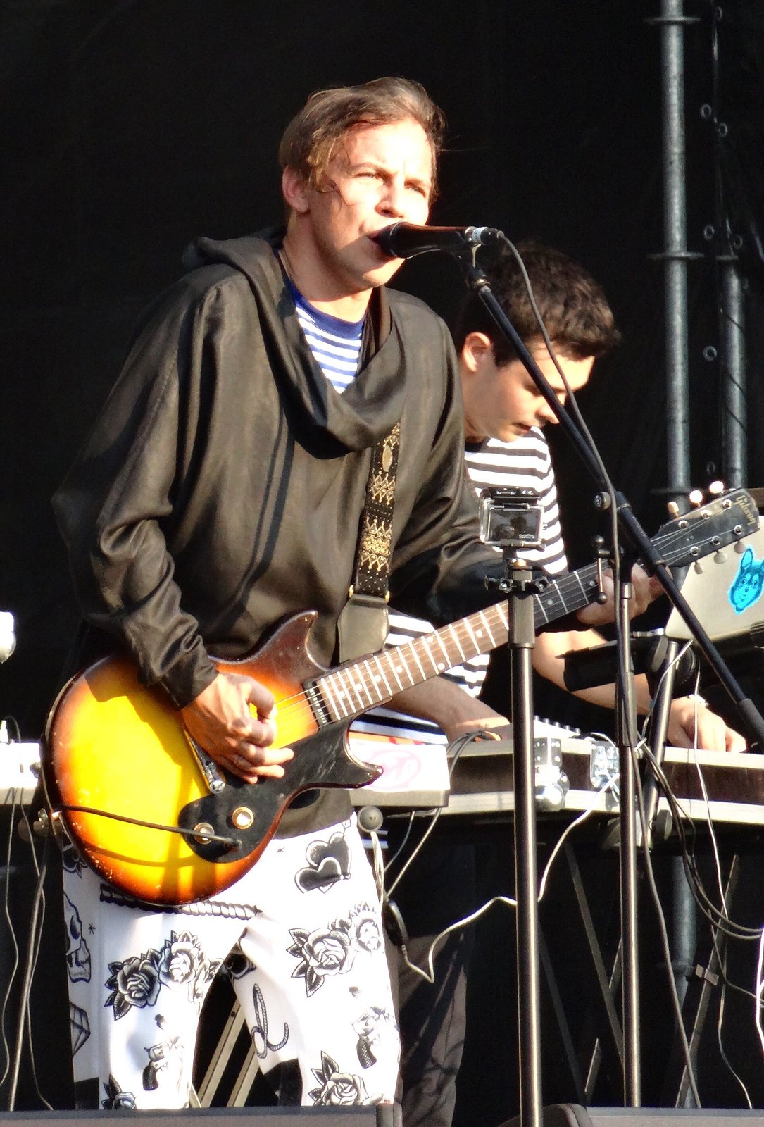 Mumiy Troll frontman Ilya Lagutenko singing with guitar at Park Live Festival, Moscow, 2013