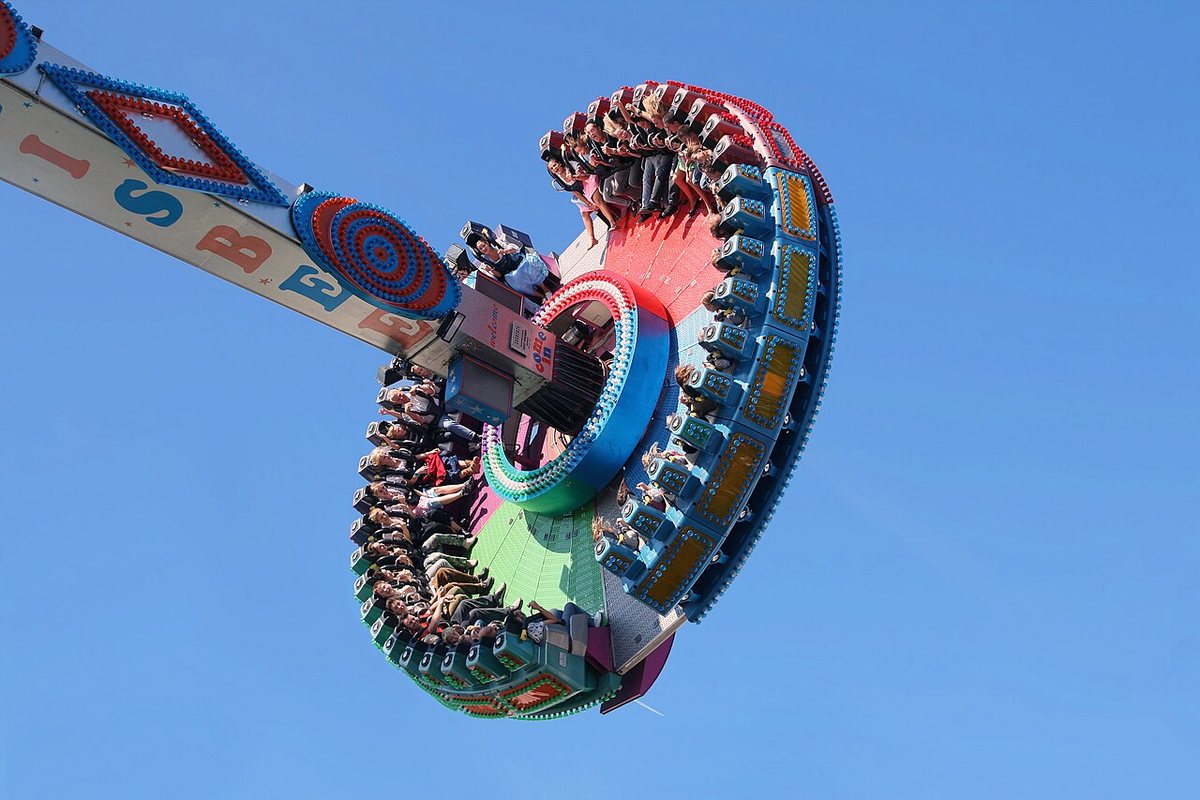 Buy Oktoberfest tickets on StubOrder Riders on the Frisbee pendulum ride against a blue sky at Munich Oktoberfest, 2007