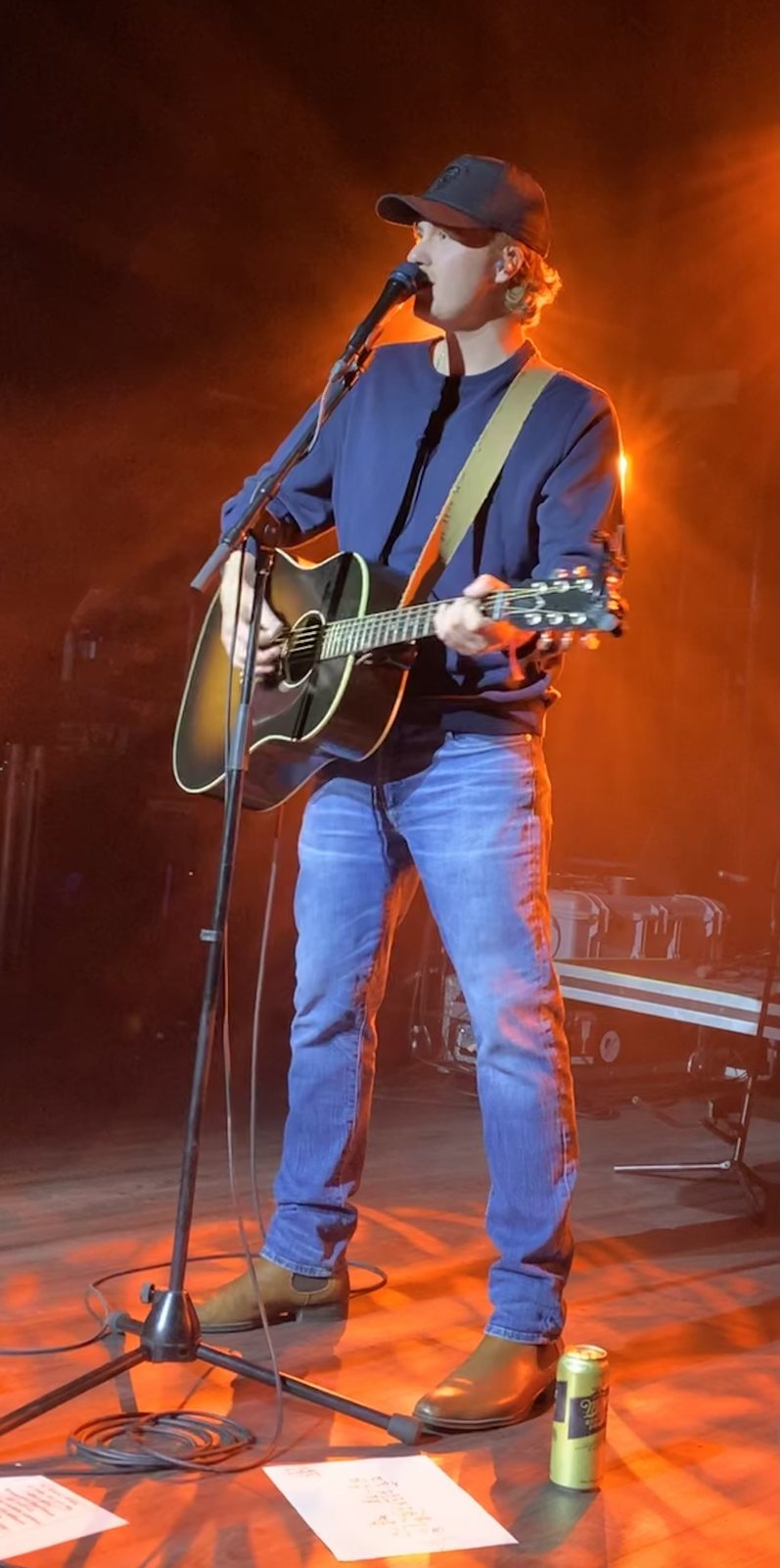 Owen Riegling singing and playing acoustic guitar on stage at the Axis Club, Toronto, November 2022