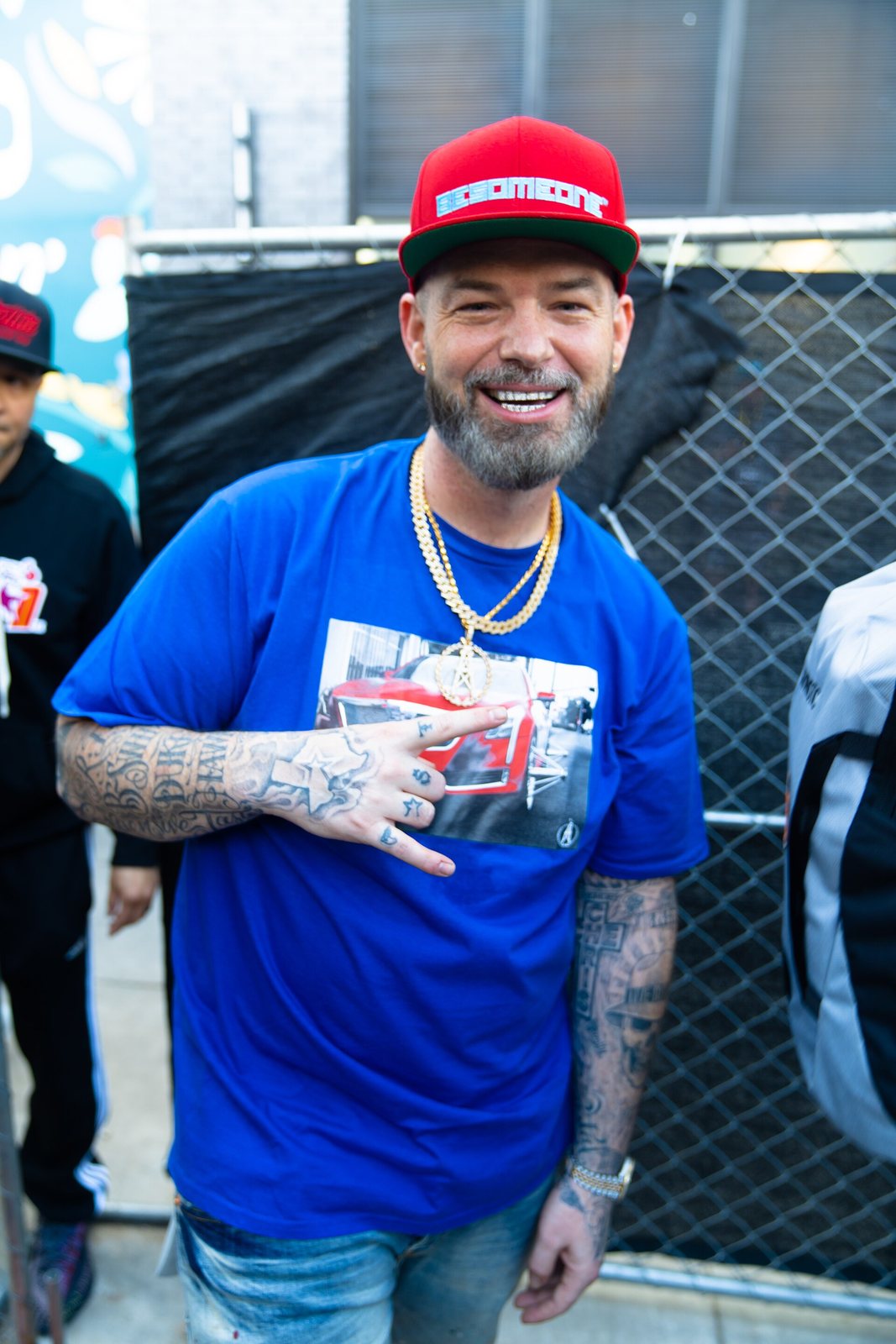 Paul Wall smiling in a red cap and blue t-shirt at South by Southwest in Austin, Texas, March 2022