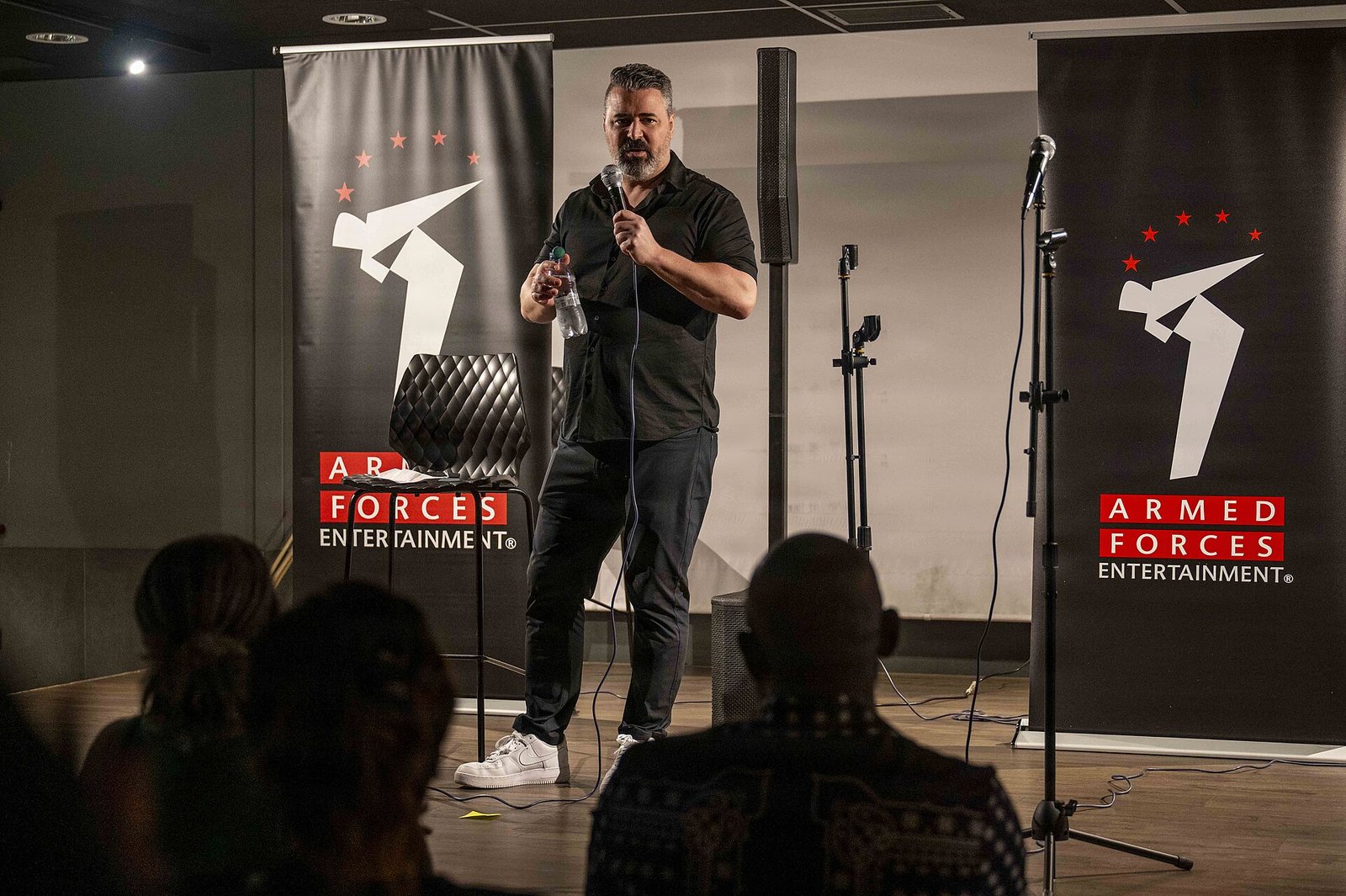 Pete Lee performing stand-up for service members at Naval Air Station Sigonella, Italy, 2026