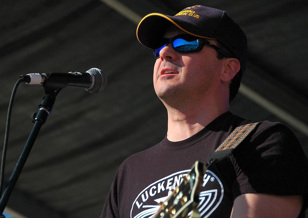 Buy Roger Creager tickets on StubOrder Roger Creager singing with his guitar on an outdoor stage, April 2009