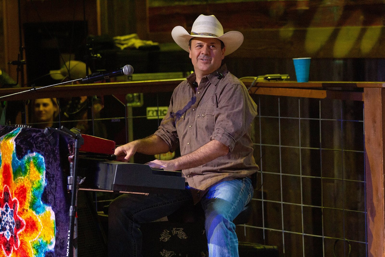 Roger Creager playing keyboard on stage at the Redneck Country Club in Texas, January 2019