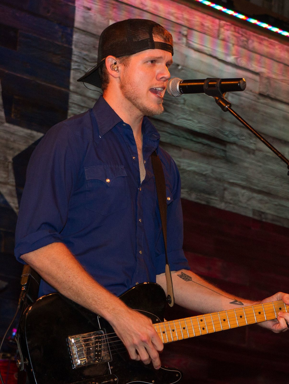 Sam Riggs singing and playing electric guitar at the Redneck Country Club, Stafford, Texas, 2014