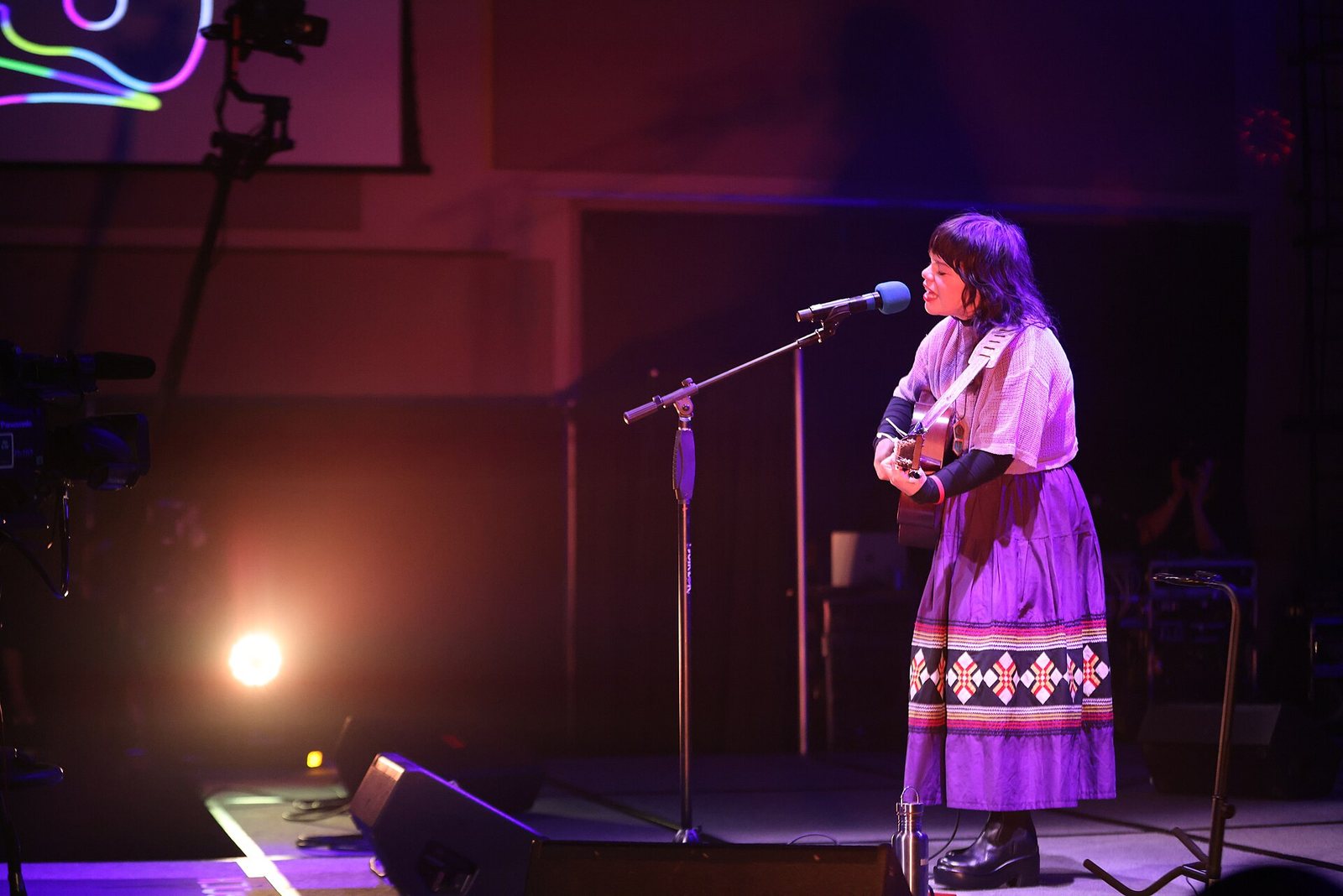 Samantha Crain singing with an acoustic guitar at the Áak'w Rock Indigenous Music Festival, Juneau, Alaska, 2023